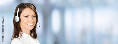 Portrait - representative call center. Businesswoman woman support phone operator. Callcenter customer service. Sales agent. Banner image with free ad text space, against blurred office background