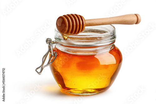 Glass jar filled with golden honey and a wooden dipper, showcasing a natural sweetener