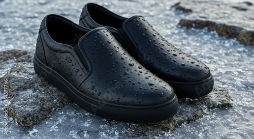 Close-up of Black Slip-on Sneakers with Water Droplets on Rocks and Ice