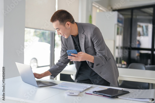 Business people holding Smartphone working mobile devices. cell telephone technology e-commerce concept.