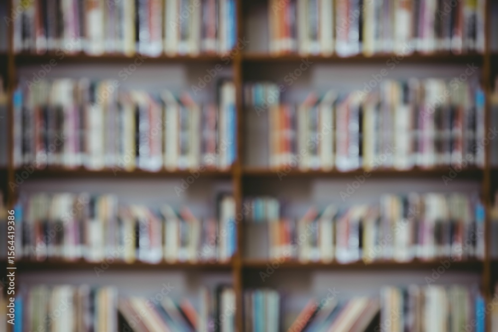 Fototapeta premium Blurred wooden bookshelf is being shown in flat design library, with rows of colorful book spines