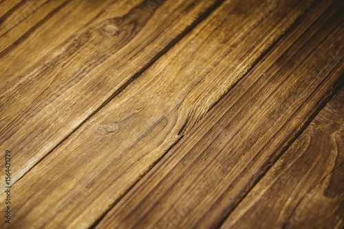 Brown wooden planks are aligning diagonally in flat design, showing natural grain and knots