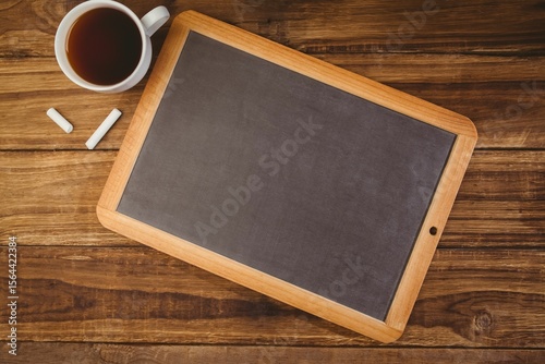 Composite image of chalkboard with coffee mug