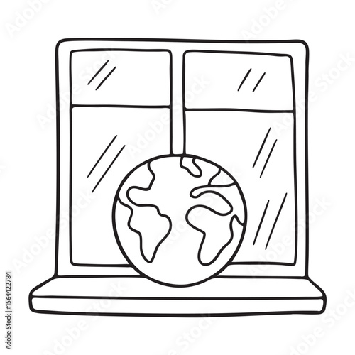 A globe patterned ball resting on a windowsill