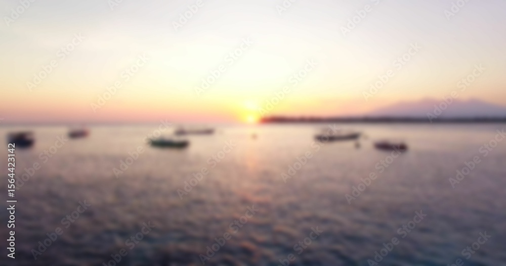 Obraz premium Defocused image of boats moored on sea
