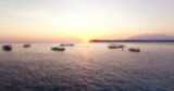 Defocused image of boats moored on sea