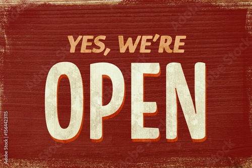 Flat-design sign is showing deep red wood with “YES, WE'RE OPEN” beige letters and orange shadow