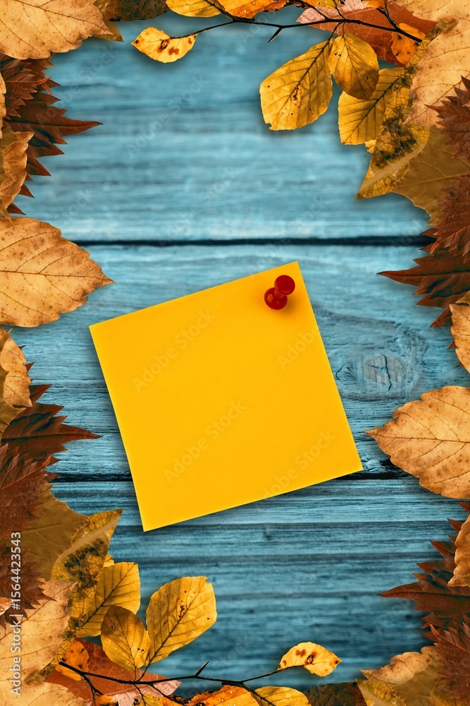 Fototapeta premium Autumn leaves with yellow note