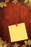 Autumn leaves with yellow note
