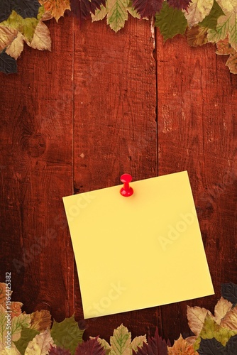 Autumn leaves with yellow note
