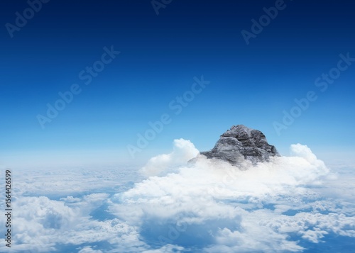 Mountain peak through the clouds