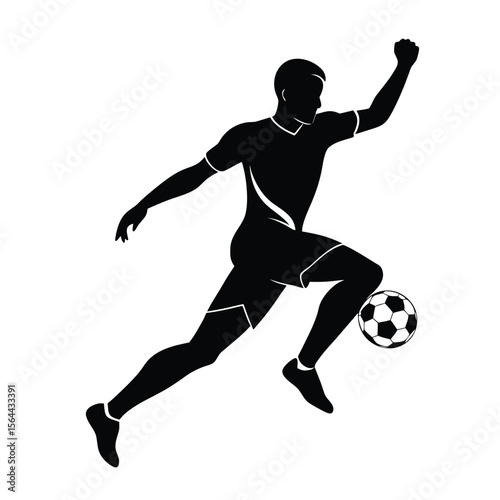 silhouette of a football player kicking a ball