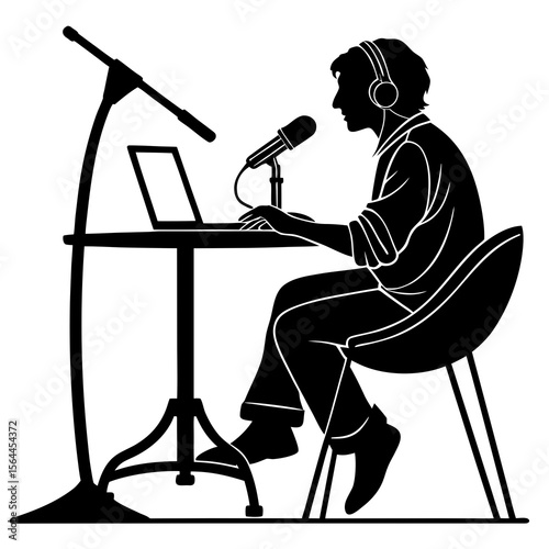 Person with Headphones Broadcasting at Desk with Microphone and Laptop