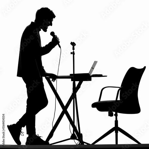 Silhouette Man Singing into Microphone at Keyboard with Laptop and Chair