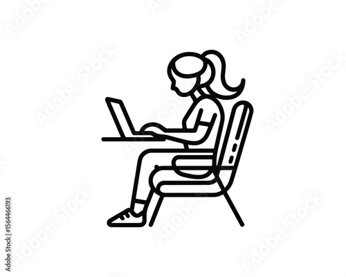 Woman working on laptop at desk  side view