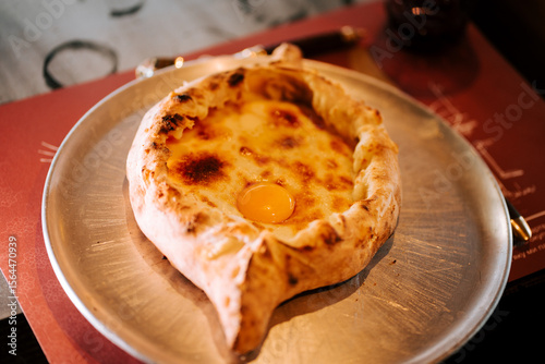Konstfotografi Delicious traditional Adjarian khachapuri served hot with a perfectly cooked egg