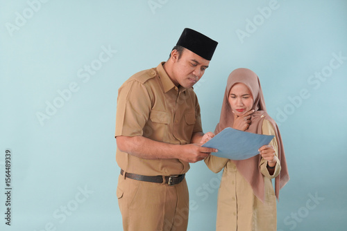 Quadro su tela two government worker man woman wearing kekhi uniform is talking on PNS, ASN civil servant concept