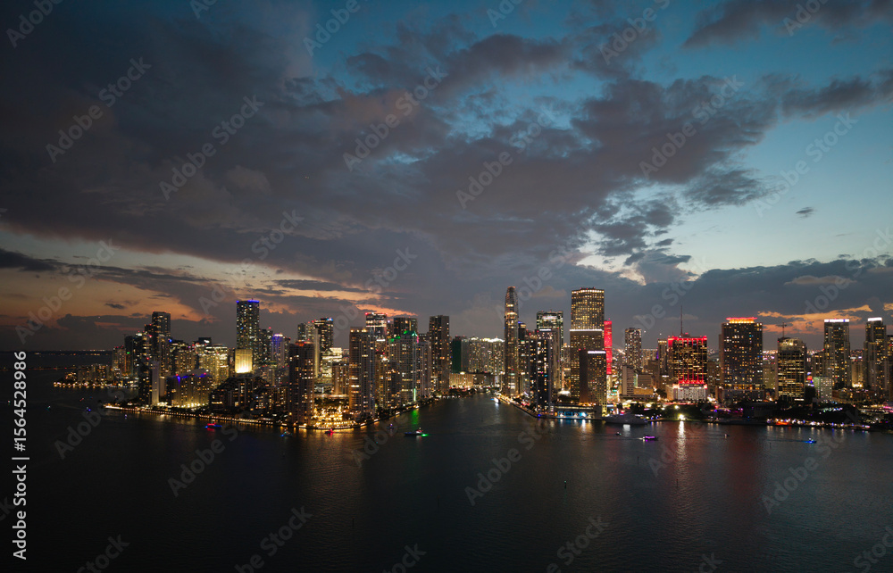 Fototapeta premium Famous landmarks of Miami Brickell from above on sunset. Drone view of the Brickell in Miami city. Business in Brickell district. Biscayne Bay Florida iconic urban coastline in daylight.