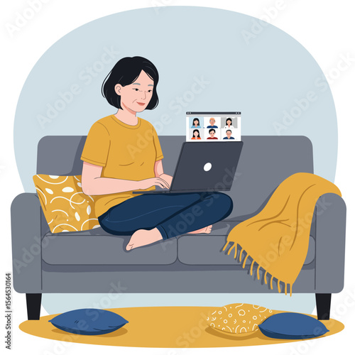A young woman comfortably works from home on her laptop, participating in a virtual video conference from her cozy living room couch.