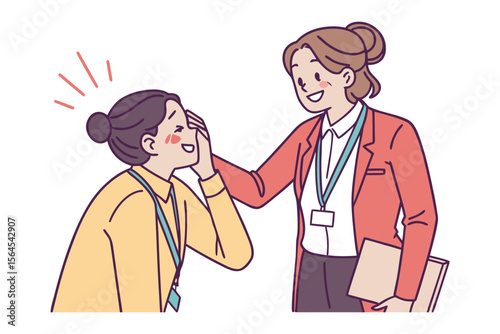 Two smiling women in business attire interacting positively one with her hand on the other s forehead conveying encouragement and support