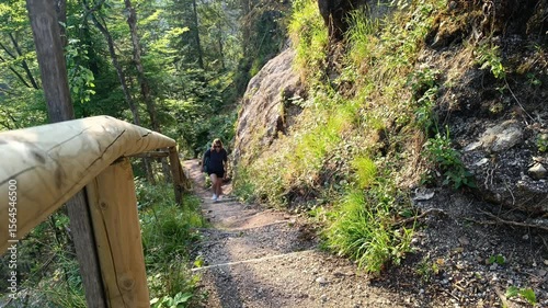 A person navigates a winding hiking trail