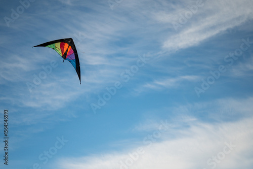 Dual line colourful kite flying in the sky, Copy space