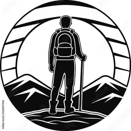 Silhouette of a hiker with a backpack and trekking poles on a mountain peak