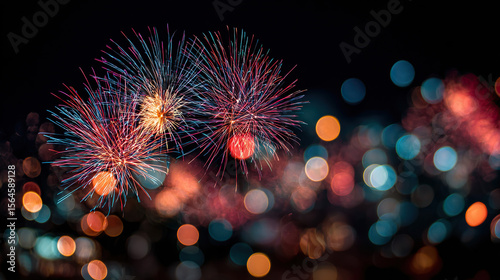 Colorful fireworks burst in the night sky, creating abstract light trails—a celebration of vibrant energy and fleeting beauty.