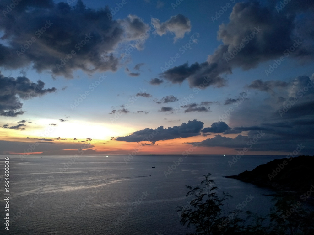Fototapeta premium Sunset at Windmill Viewpoint in Phuket, Thailand – Scenic Coastal Landscape