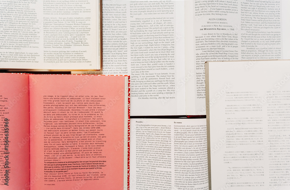 Obraz premium Open books arranged flat and shot from above. Focus on paper texture and typography. Educational and aesthetic