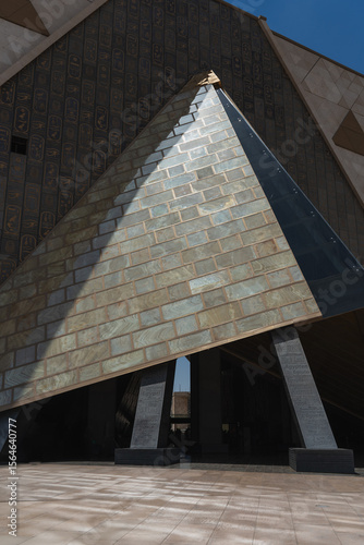 Grand egyptian museum showcasing striking pyramid design and hieroglyphic facade