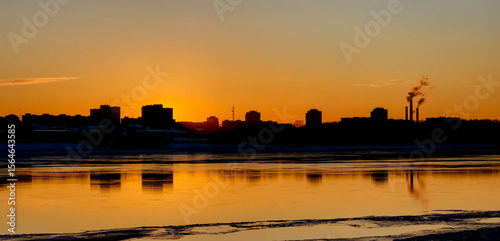Wallpaper Mural A beautiful orange sunset with a black silhouette of city buildings Torontodigital.ca
