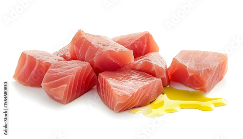 Tuna pieces with oil drops isolated on white background
