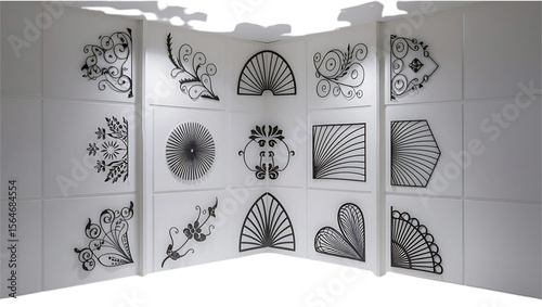 Collection of decorative black ornamental designs on white panels