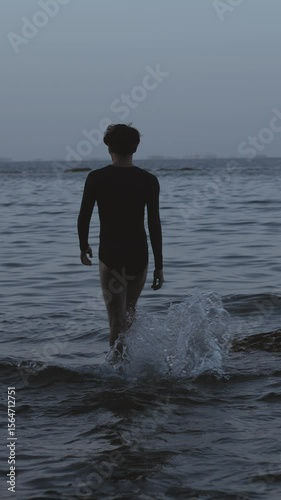 Man Walking in Shallow Sea Water 2