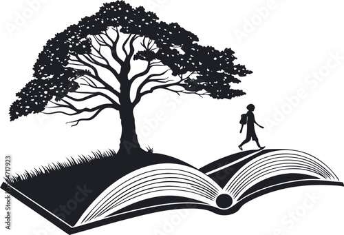 silhouette of a giant book lying open with a tree.