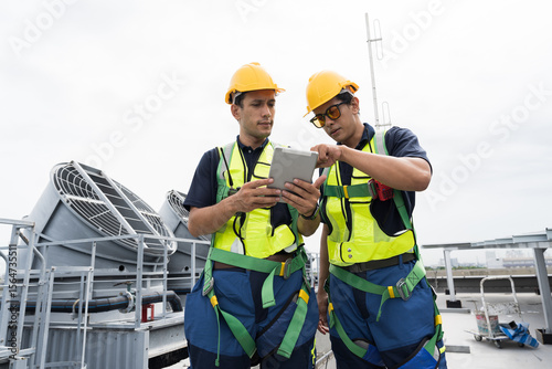 Cooling tower operations, Induced draft cooling towers service.
Team of engineer or technicians maintenance and repair of cooling towers for preventing issues Legionella growth on rooftop of building