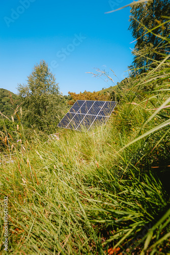 Solar panels in remote mountain field