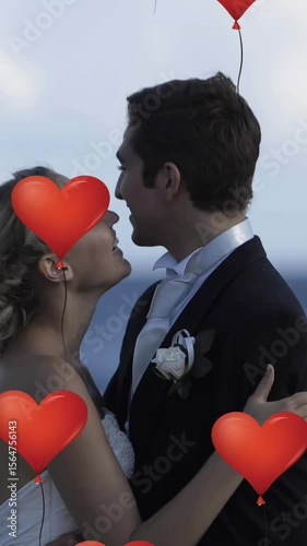 Multiple heart balloons floating against new married couple embracing each other at beach