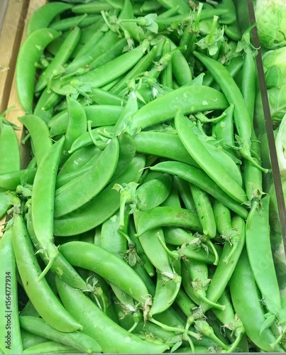 Fresh green pea pods in piled.