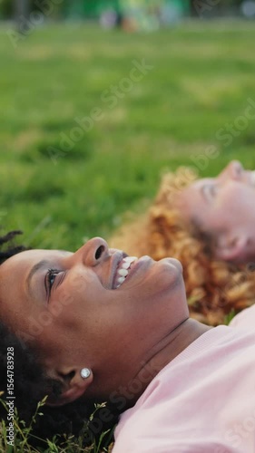 Multiethnic friends laughing together in slow motion