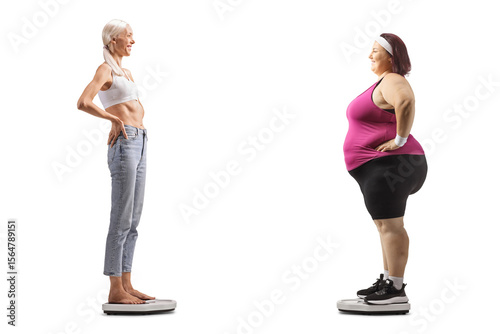 Slim and overweight woman standing on weight scales