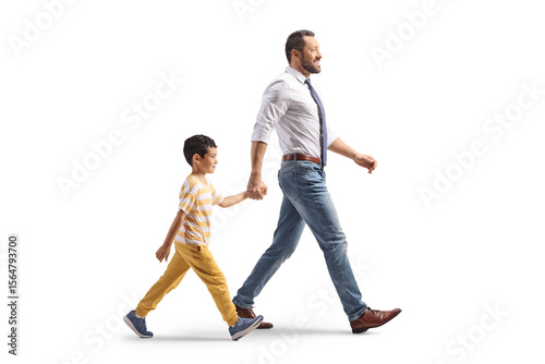 Father and a son walking together and holding hands