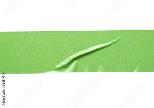 A tiny green worm is isolated on transparent background, its slender body curving gently against a smooth, pale green backdrop