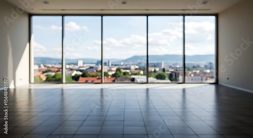 Beautiful blurred background of a light modern office interior with panoramic windows and beautiful lighting Bright window view, city skyline, empty room, natural light, urban landscape, modern archit
