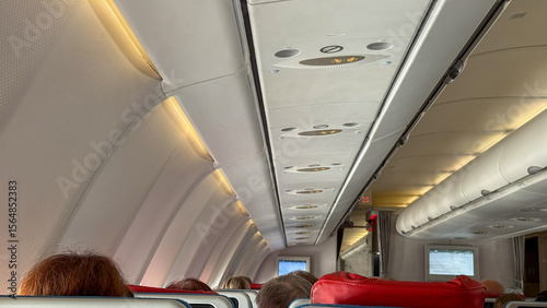 Fotografie Inward journey above the clouds, serene cabin glow, whispers of wanderlust, excl