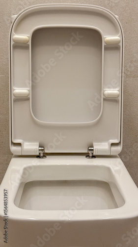 Minimalist porcelain throne awaits introspective pondering, celebrating World Toilet Day and quirky bathroom zen sanctuary vibes