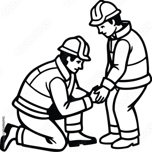A construction worker kneels to adjust a colleague’s safety boot lace