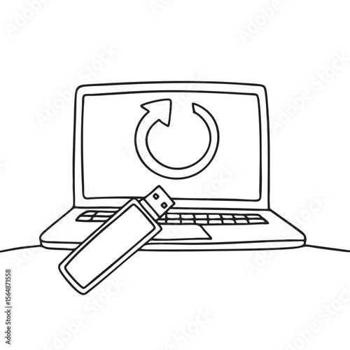 A thumb drive near a laptop with a firmware update tag