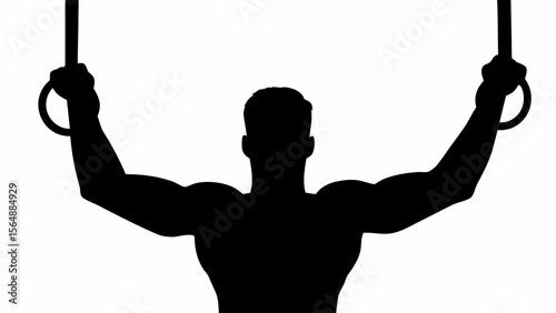 Silhouette of muscular gymnast performing on gymnastic rings with arms extended and focused on strength pose